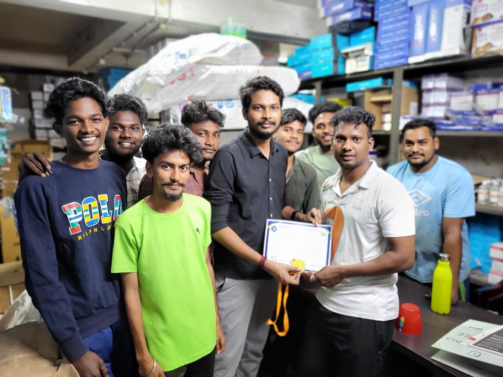 Naveen Kumar with a group of young residents