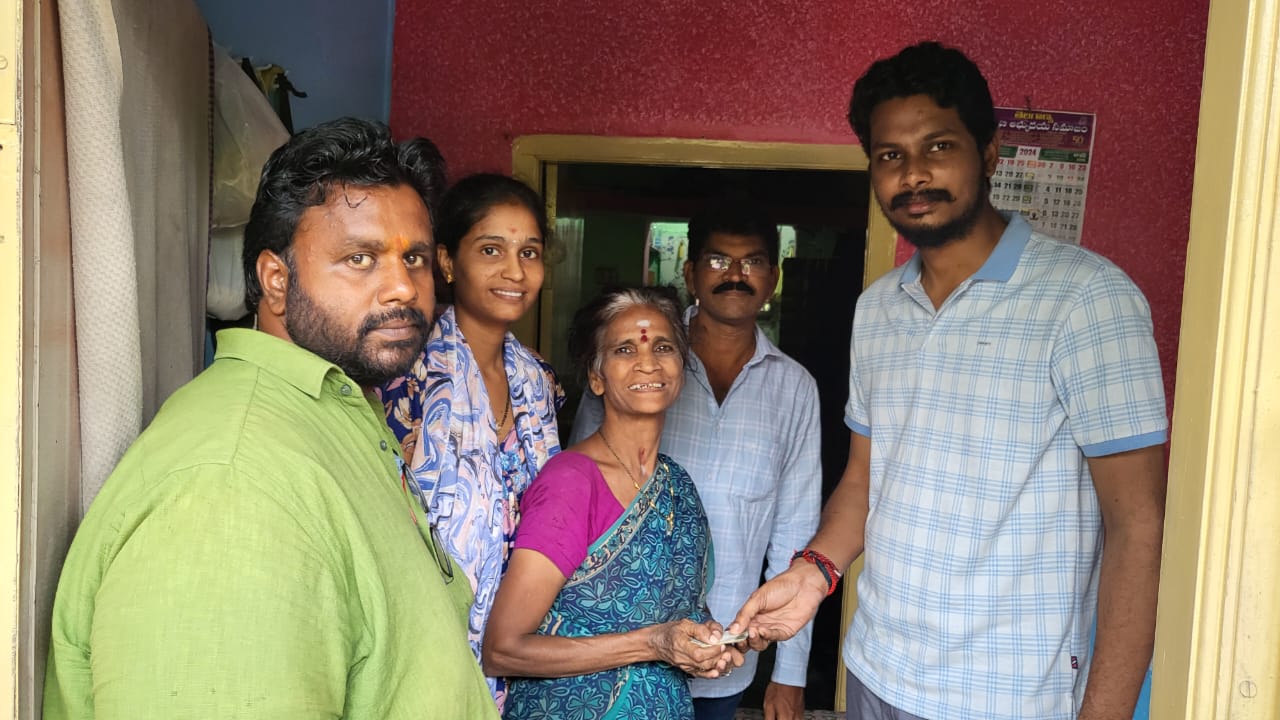 Naveen Kumar meeting a family at their home
